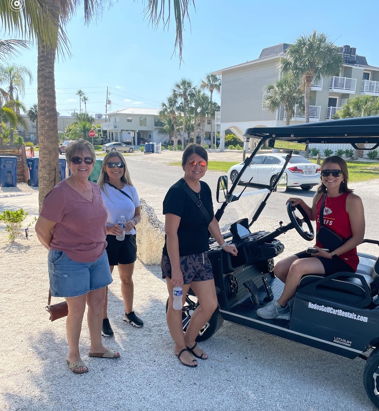 Group of women enjoying a golf cart rental on Siesta Key with Hodo's